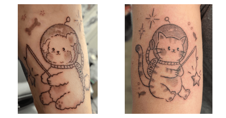 The most adorable  matching tattoos of a space dog and a space cat fishing for shooting stars! I really wish I was better at these alt text descriptions, I'm so sorry. Please ask Jenn for more detail - Catherine