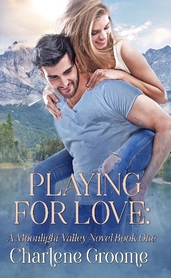 The cover of Moonlight Valley series book 1 Playing For Love by Charlene Groome. The image is of a strapping white man with dark hair and a close shaved beard giving a piggy back ride to a white woman with golden blond hair. Both are smiling and how could they not be with those stunning mountains in the background? 