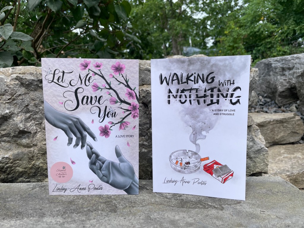 A photo of Let Me Save You with it's beautiful cherry blossom tree and hands reaching for each other, and a copy of Walking With Nothing iwth it's cloud of smoke billowing from a cigarette on an ashtray. Both images are striking hand drawn illustrations.
